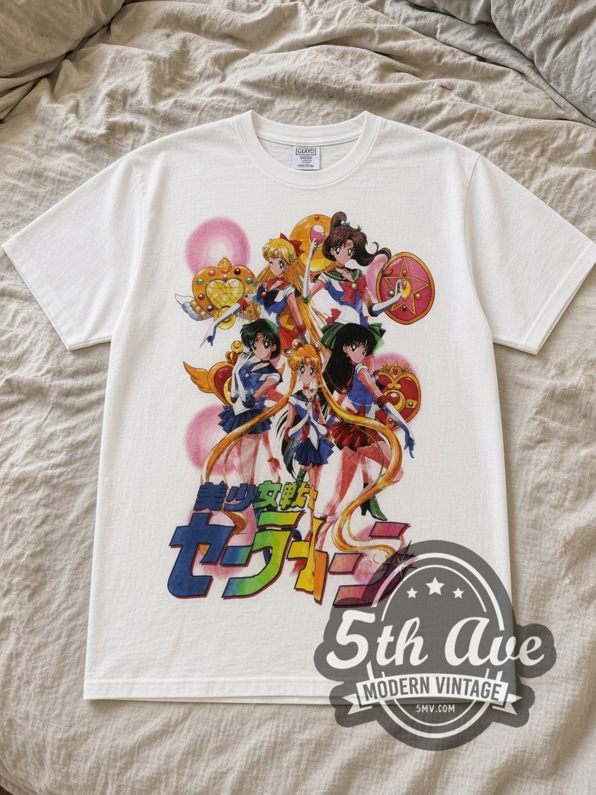White Sailor Moon Full Crew Tribute Vintage Anime T-Shirt laid flat on a linen bed