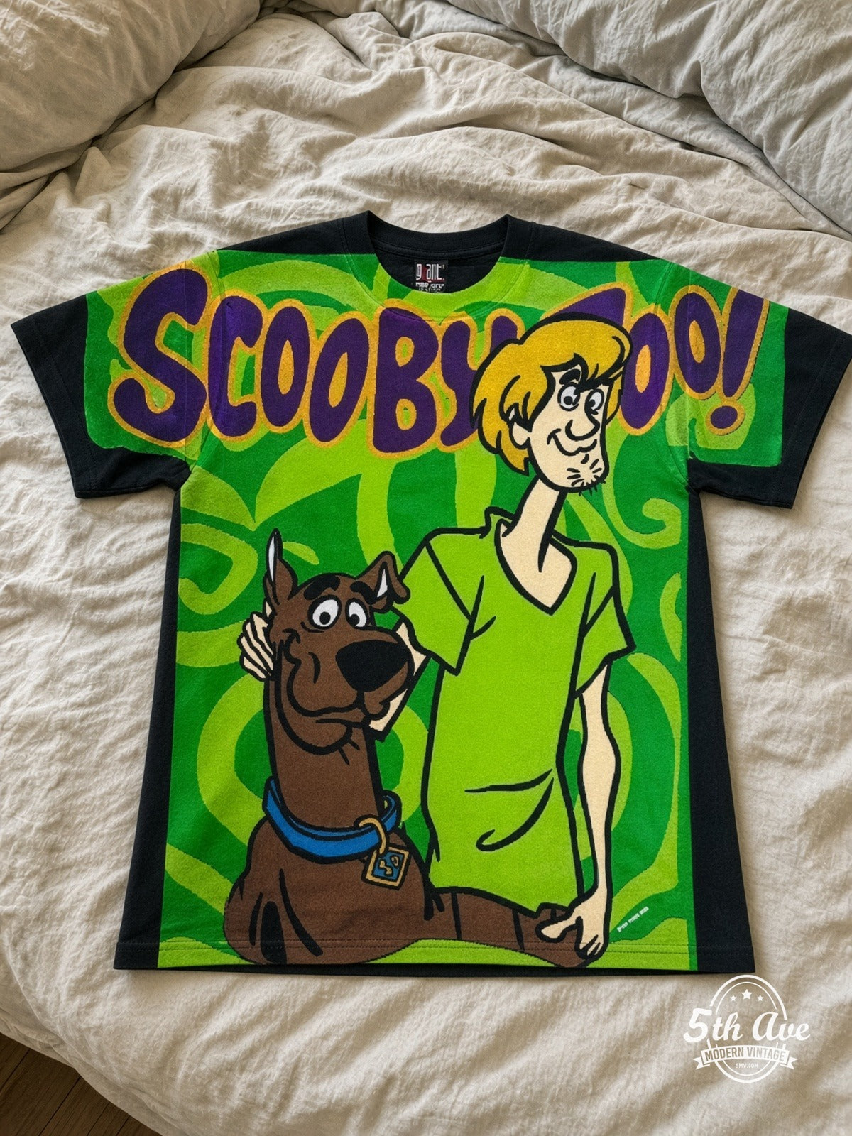 Scooby-Doo Scooby Shaggy Green Swirl vintage tee laid on bed
