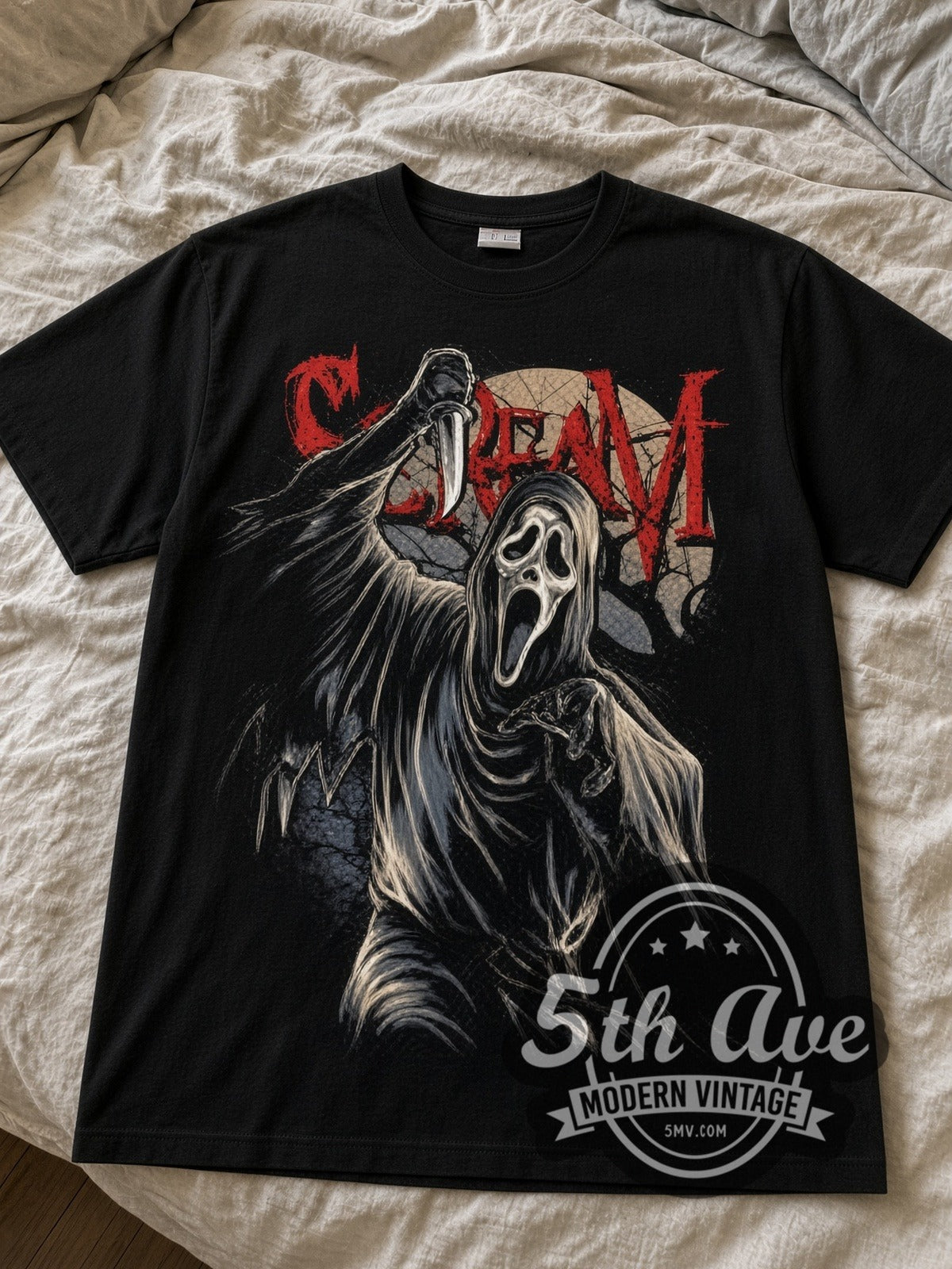 Scream Ghostface black graphic tee laid flat on linen bed