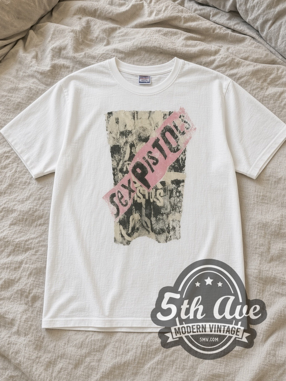 White Sex Pistols Vintage Band T-Shirt laid flat on a linen bed
