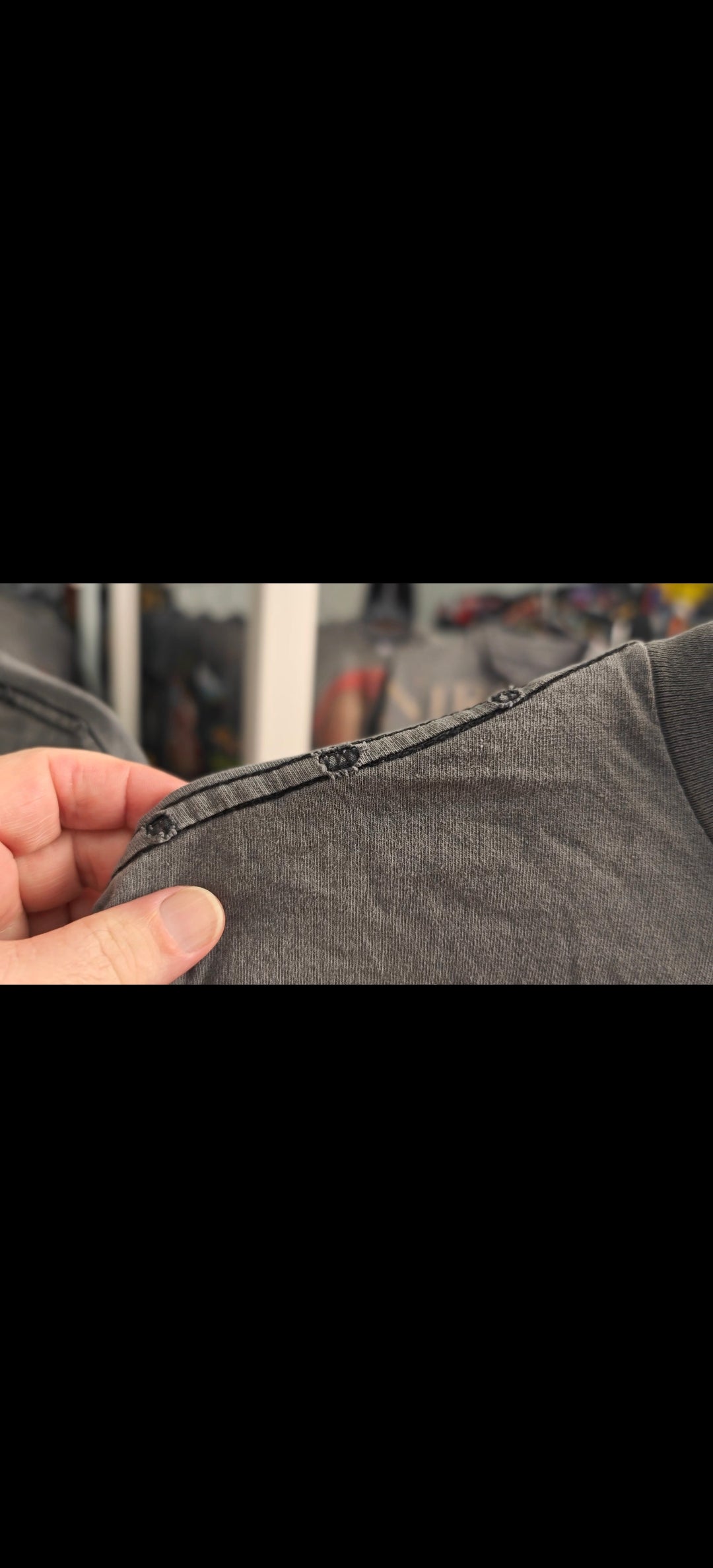 Distressed t-shirt shoulder seam holes and fray — shirt distressing example