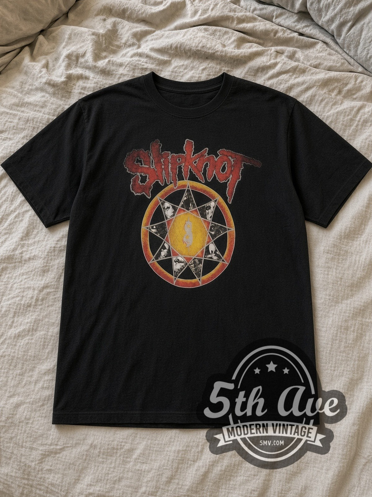 Black Slipknot Nonagram Tribal S Member Portraits Vintage Band T-Shirt laid flat on a linen bed