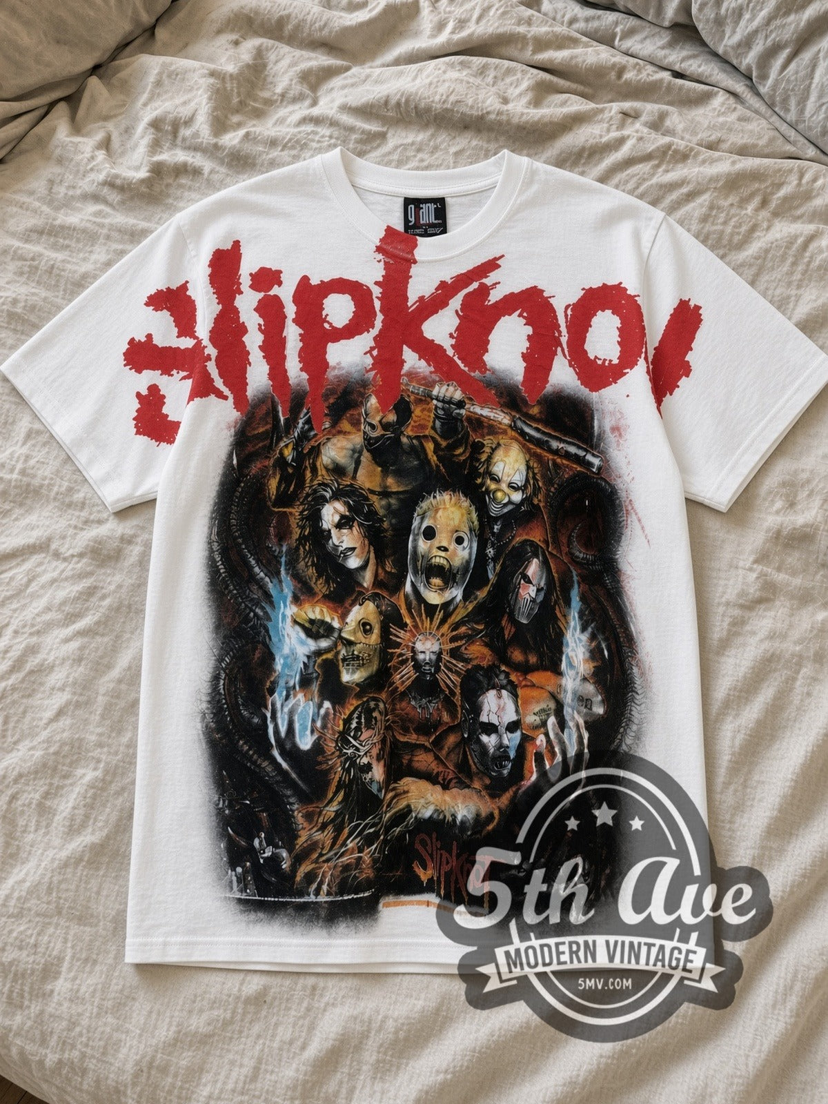 White Slipknot Masks and Goat All Over Print Vintage Band T-Shirt laid flat on a linen bed