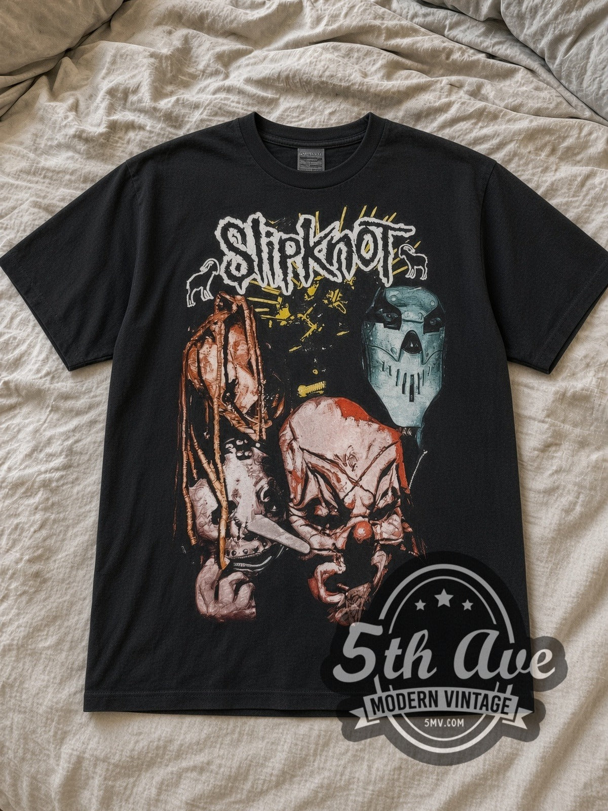 Black Slipknot Iowa Masks Vintage Band T-Shirt laid flat on a linen bed