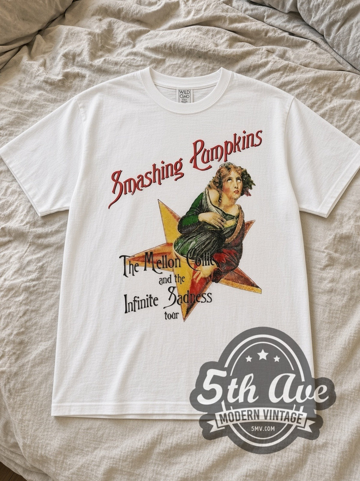 White The Smashing Pumpkins Mellon Collie and the Infinite Sadness 1996 Tour Vintage Band T-Shirt laid flat on a linen bed