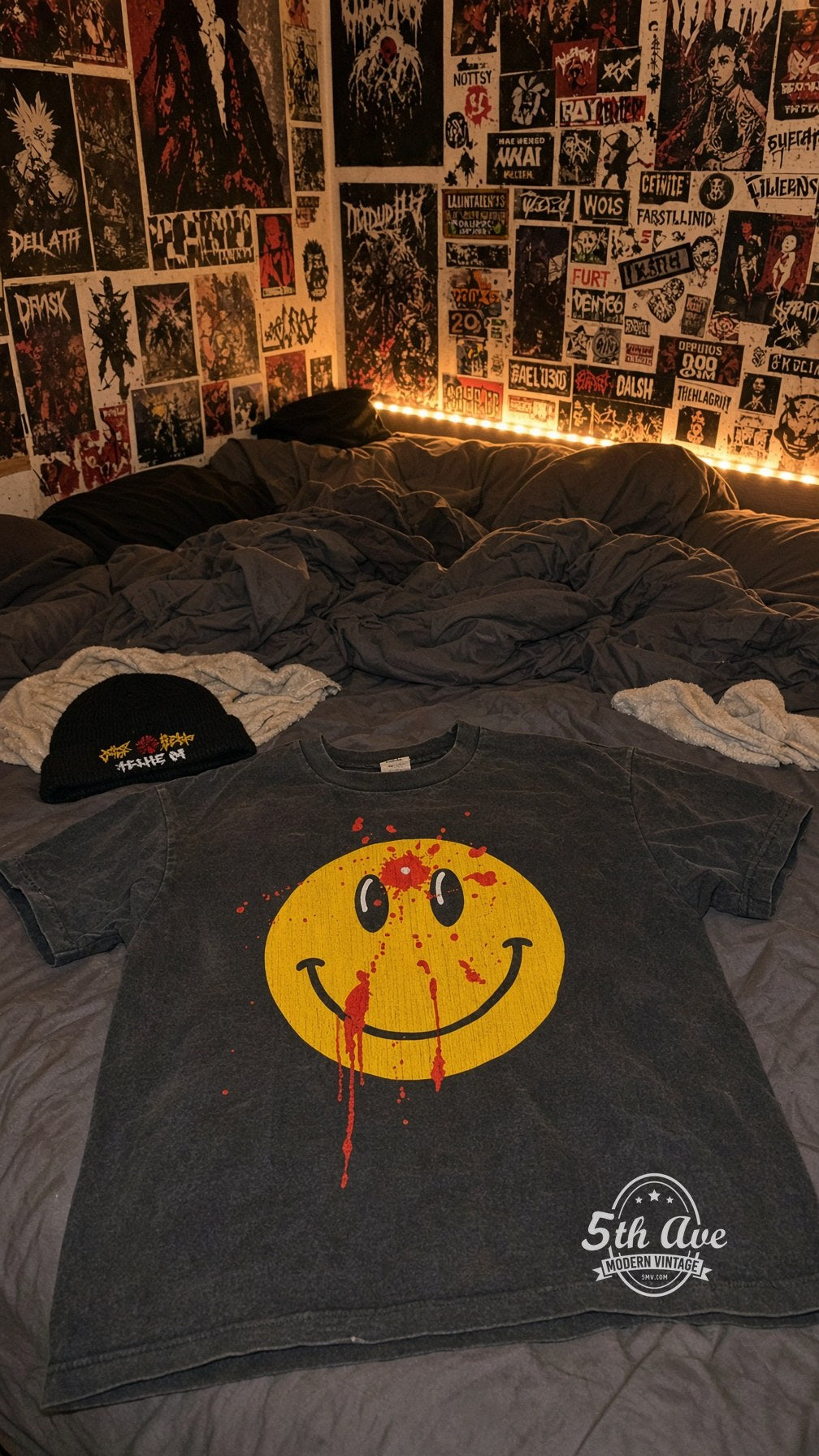 Smiley Face Bullet Hole vintage band t-shirt on bed