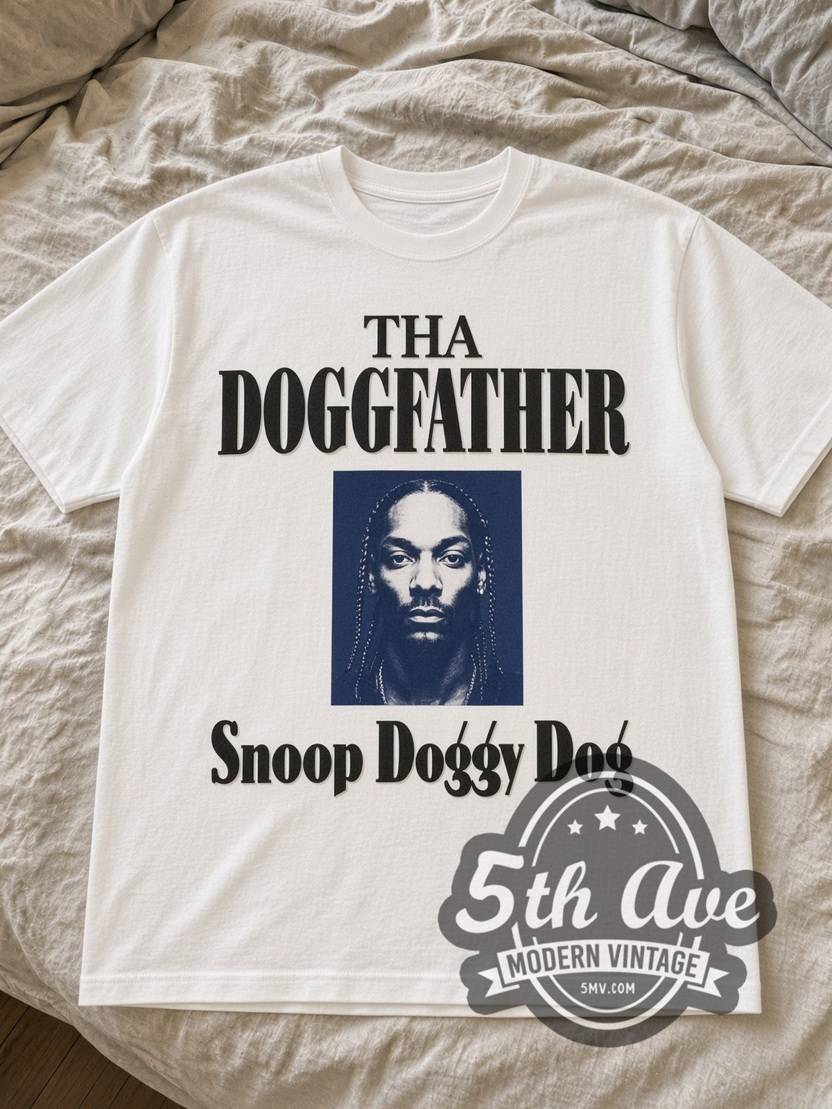White Snoop Doggy Dogg Doggfather tee laid flat on linen bed