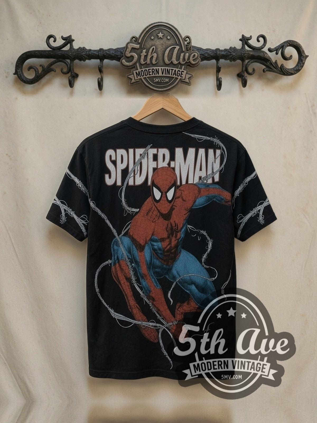 Spider-Man Crouching Pose Big Logo all-over-print vintage graphic t-shirt, back view on a hanger