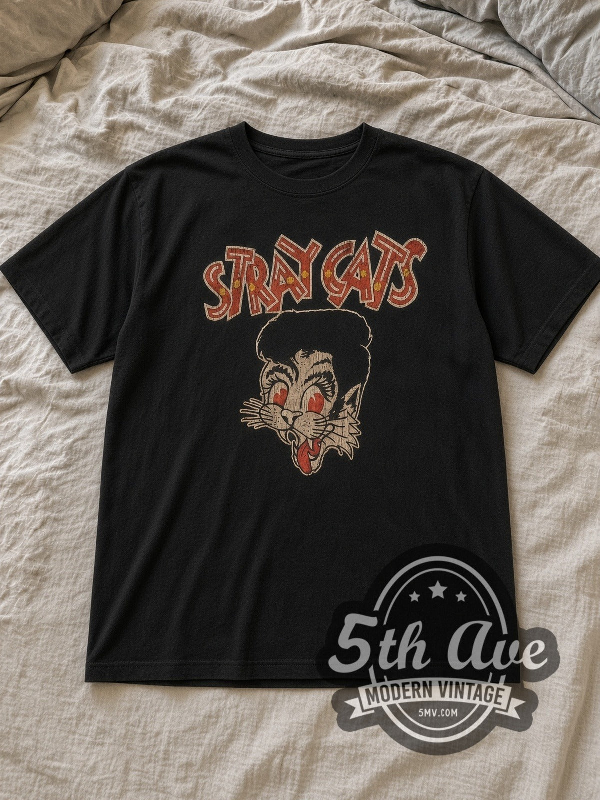 Black Stray Cats Red Eyes Pompadour Cat Logo Vintage Band T-Shirt laid flat on a linen bed
