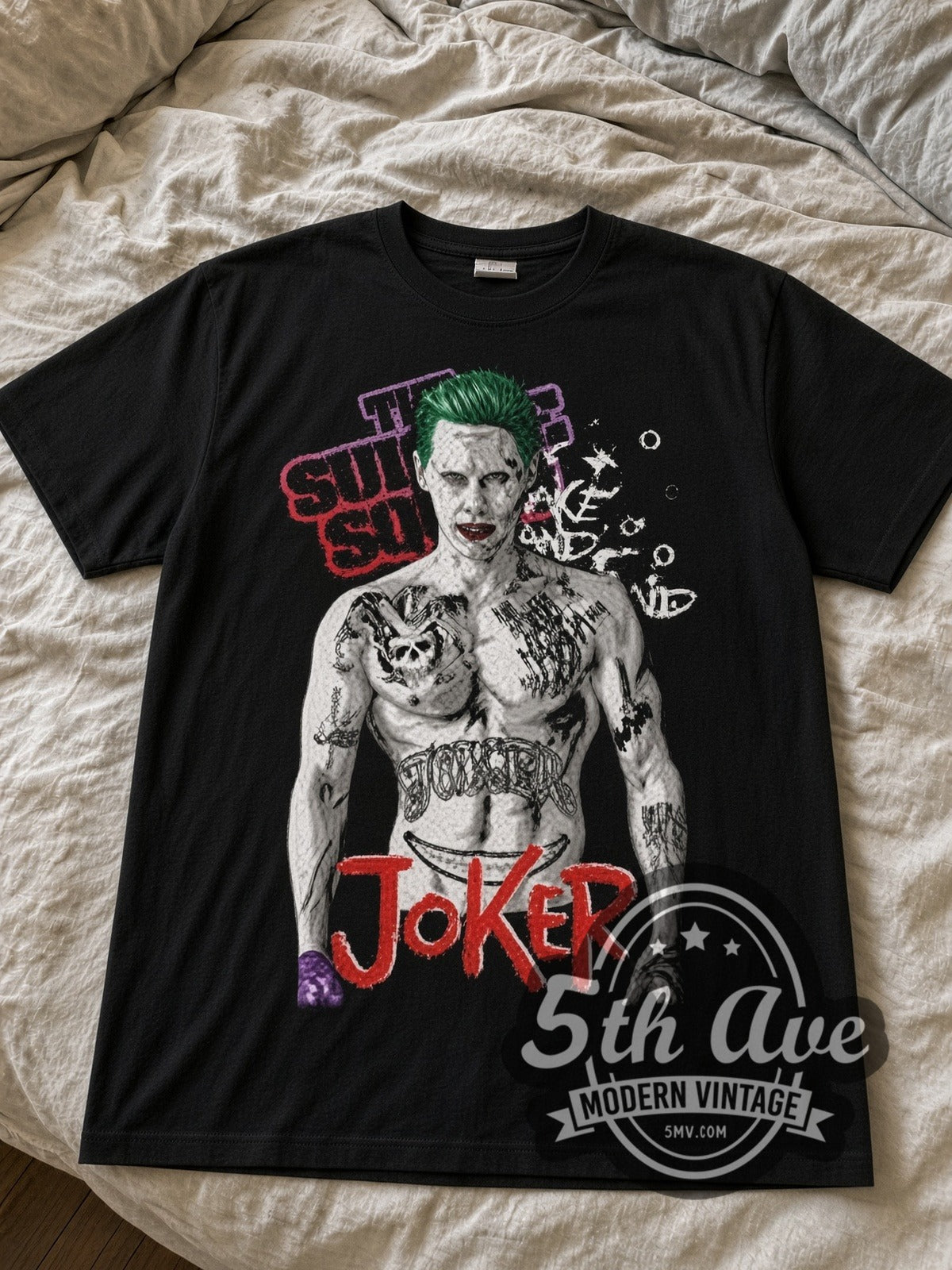 Suicide Squad Jared Leto Joker Tattooed black graphic tee laid flat on linen bed