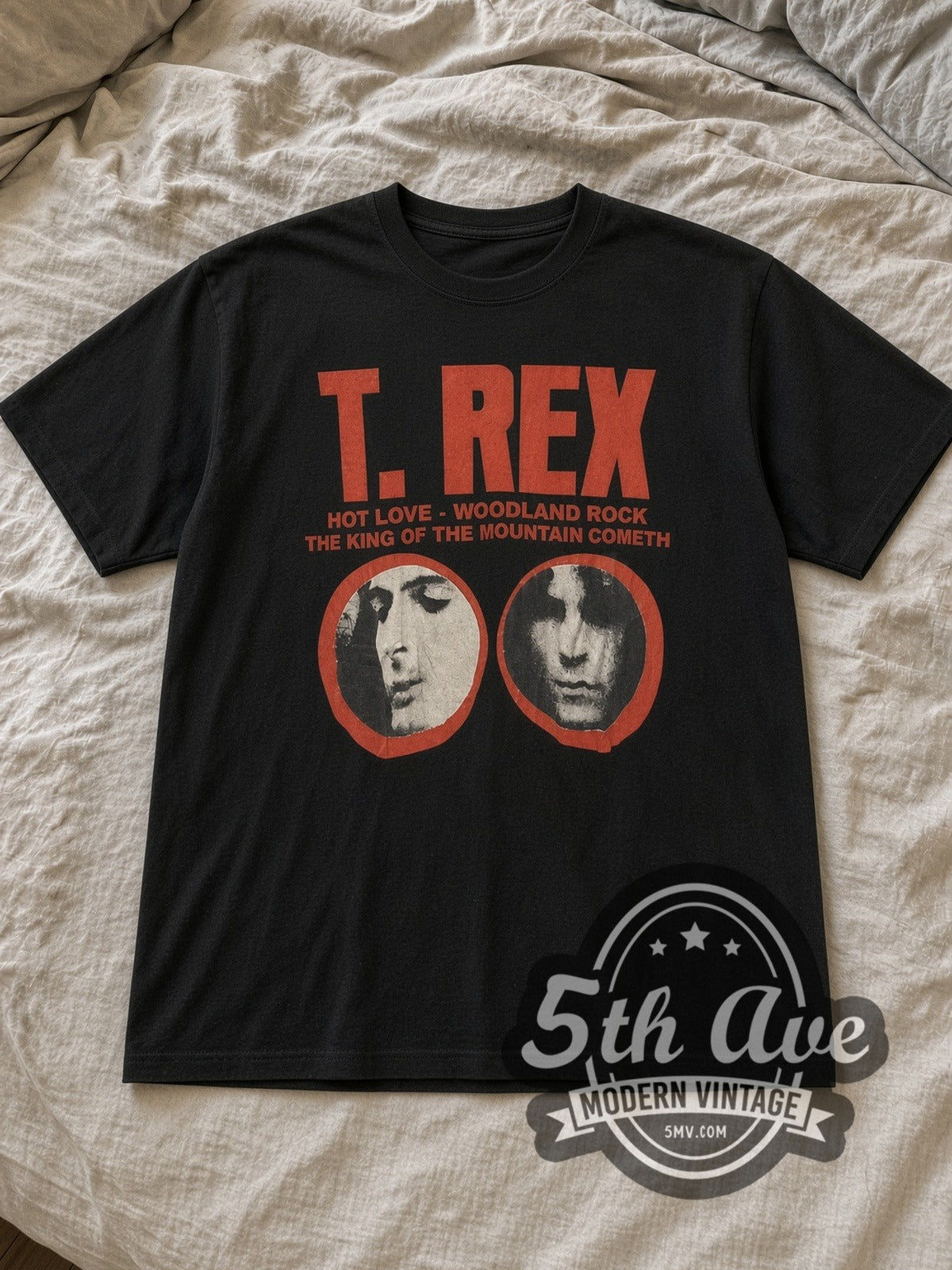 Black T. Rex Twin Portraits Logo Vintage Band T-Shirt laid flat on a linen bed