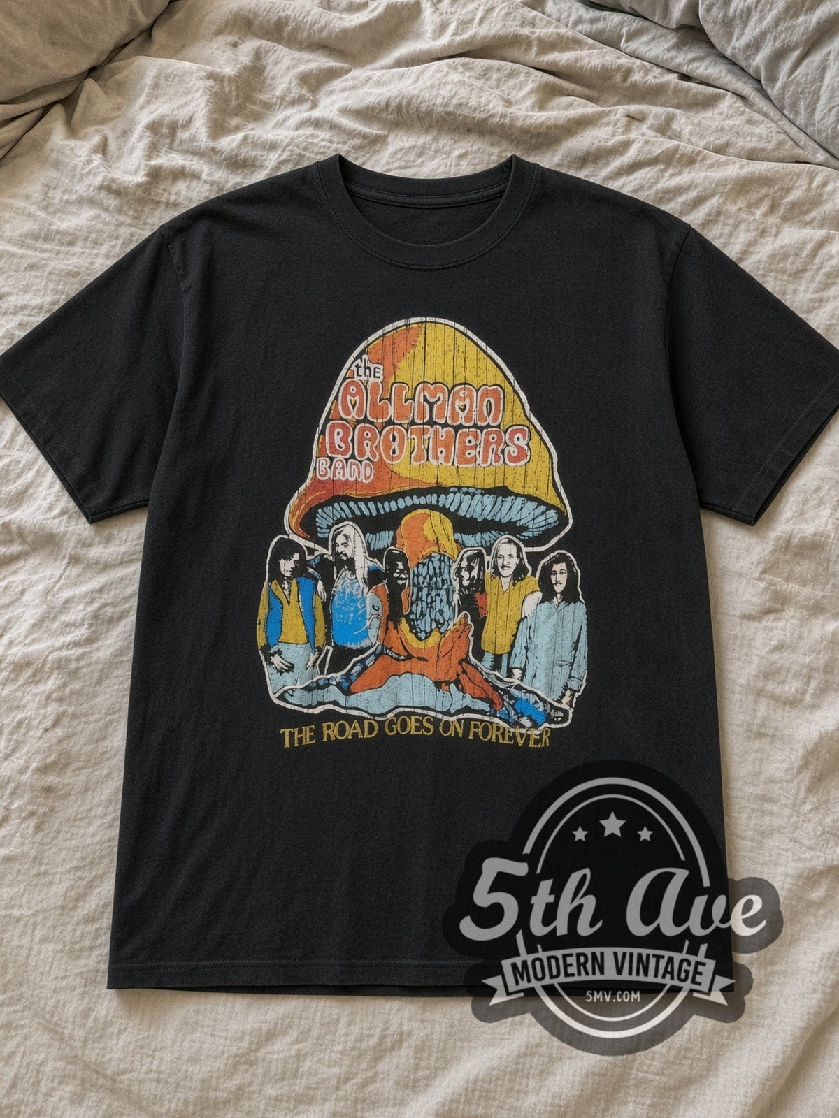 Black The Allman Brothers Band The Road Goes On Forever Vintage Band T-Shirt laid flat on a linen bed