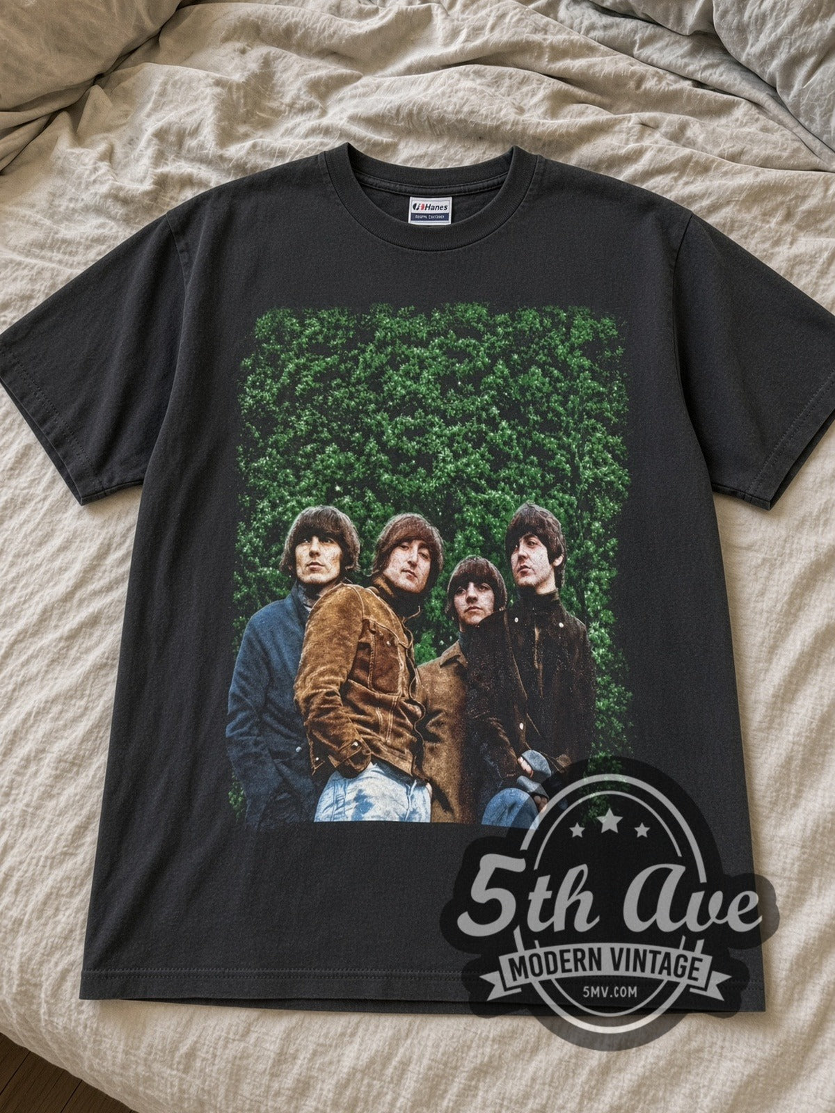 Black Beatles Rubber Soul tee laid flat on linen bed