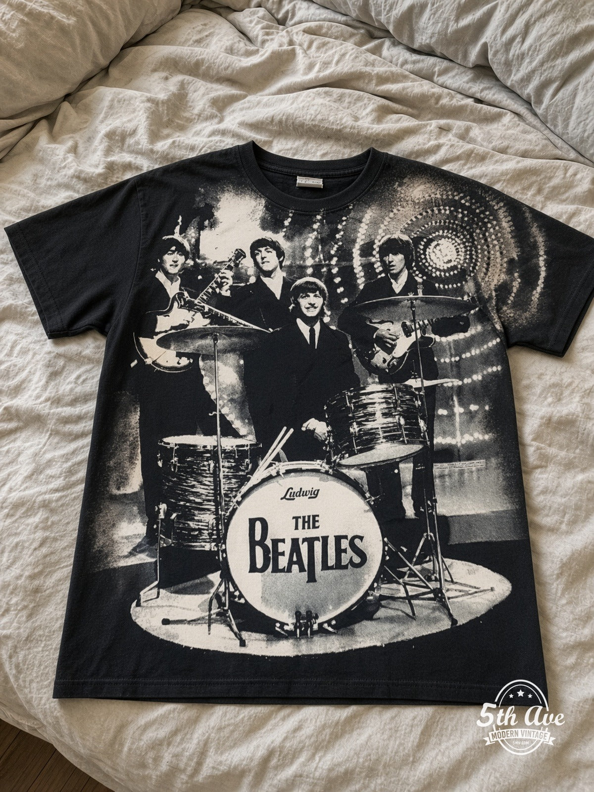 The Beatles Photo Collage Drums all over print vintage tee laid on bed