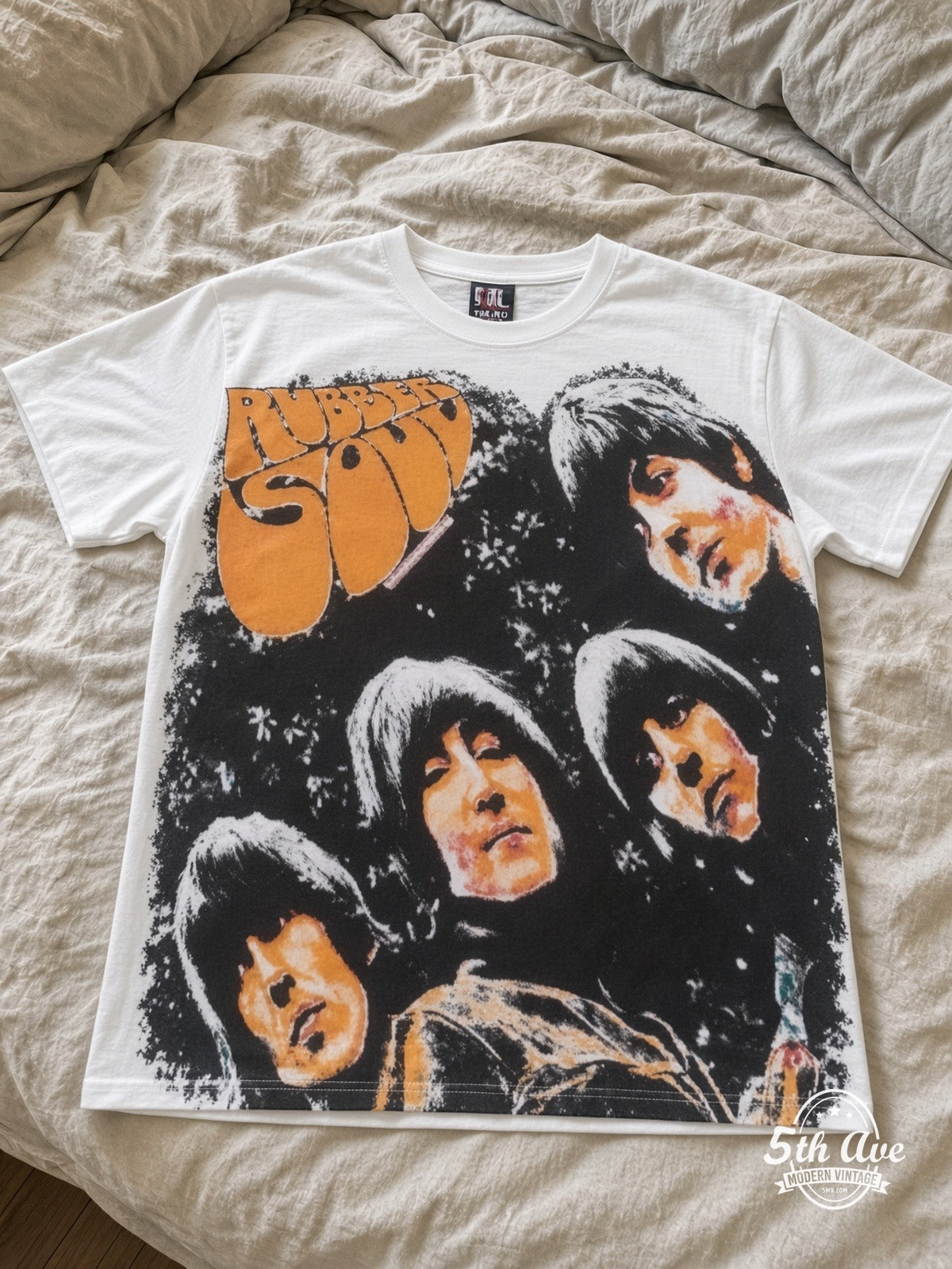 The Beatles Rubber Soul all over print vintage tee laid on bed