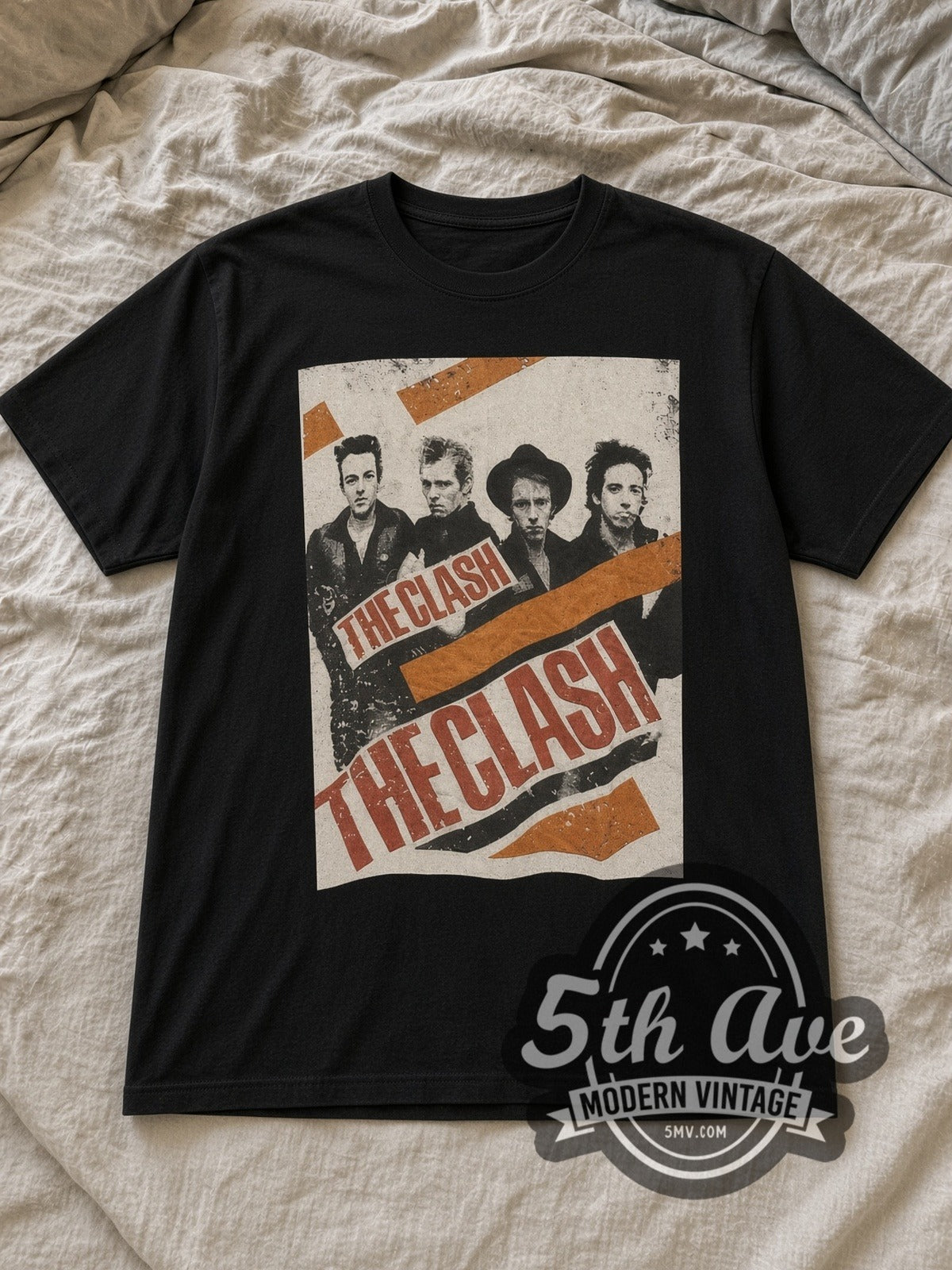 Black The Clash Band Photo Logo Vintage Band T-Shirt laid flat on a linen bed