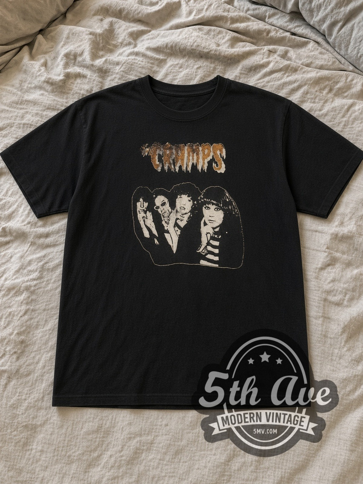 Black The Cramps Band Photo Vintage Band T-Shirt laid flat on a linen bed