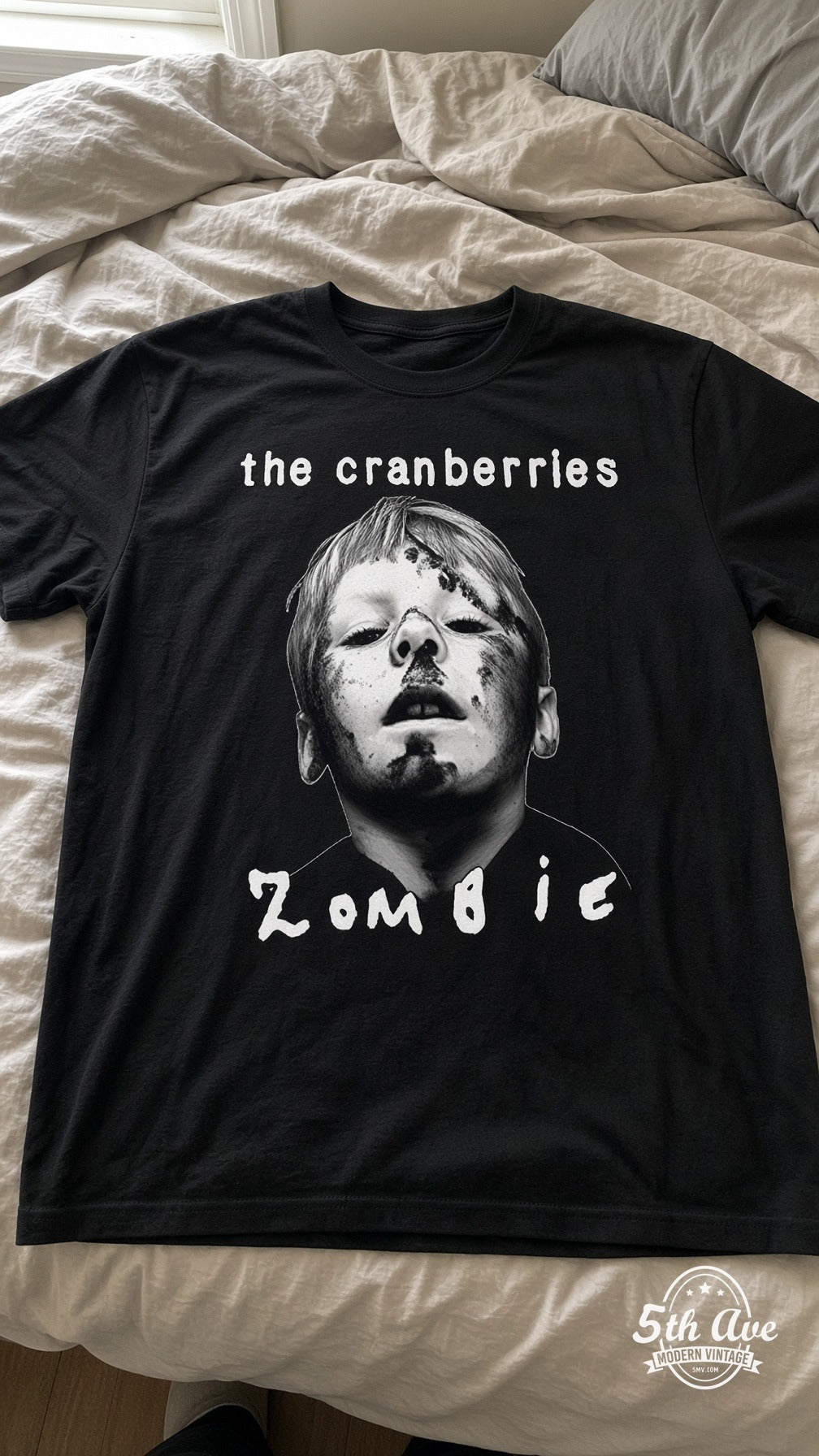 Cranberries Zombie vintage t-shirt laid on bed