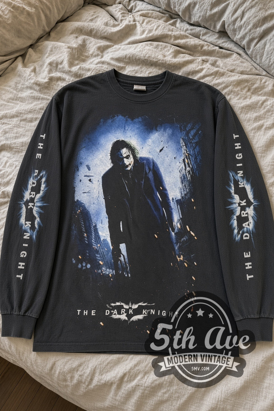 The Dark Knight Joker Street Poster Long Sleeve vintage movie tee laid flat on bed