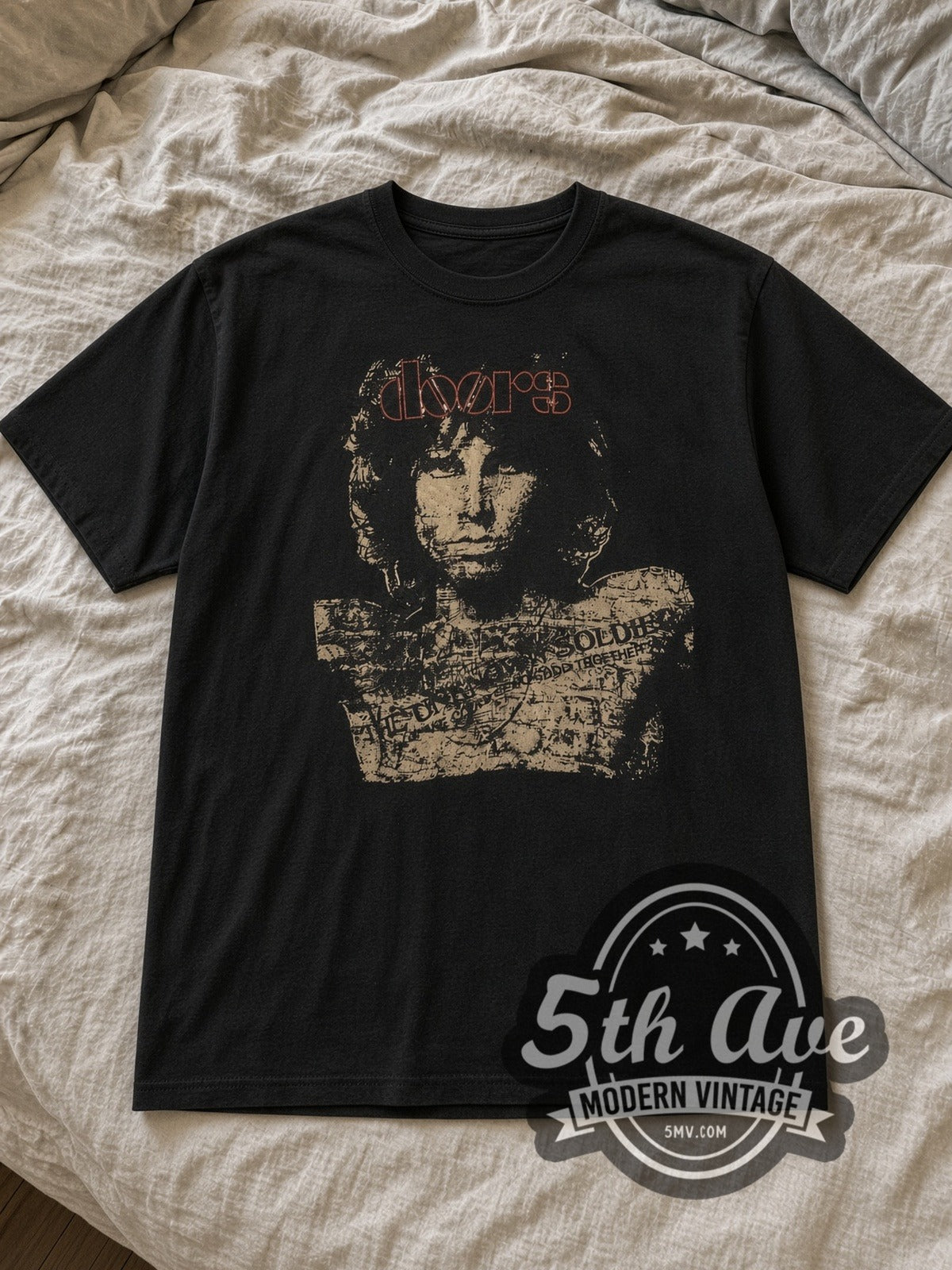 Black The Doors Jim Morrison Portrait Vintage Band T-Shirt laid flat on a linen bed