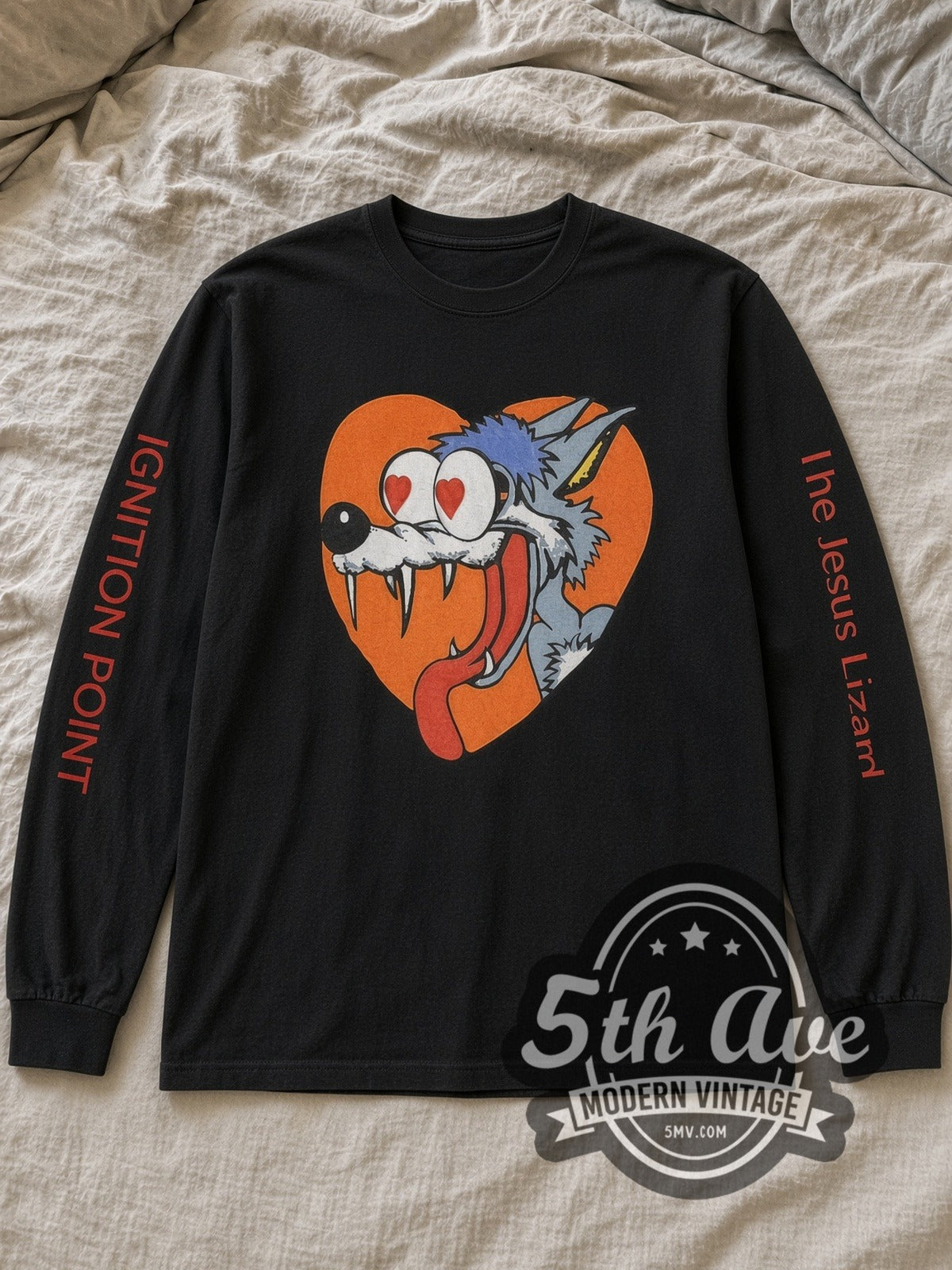 Black The Jesus Lizard You Idiot Vintage Band Long Sleeve T-Shirt laid flat on a linen bed