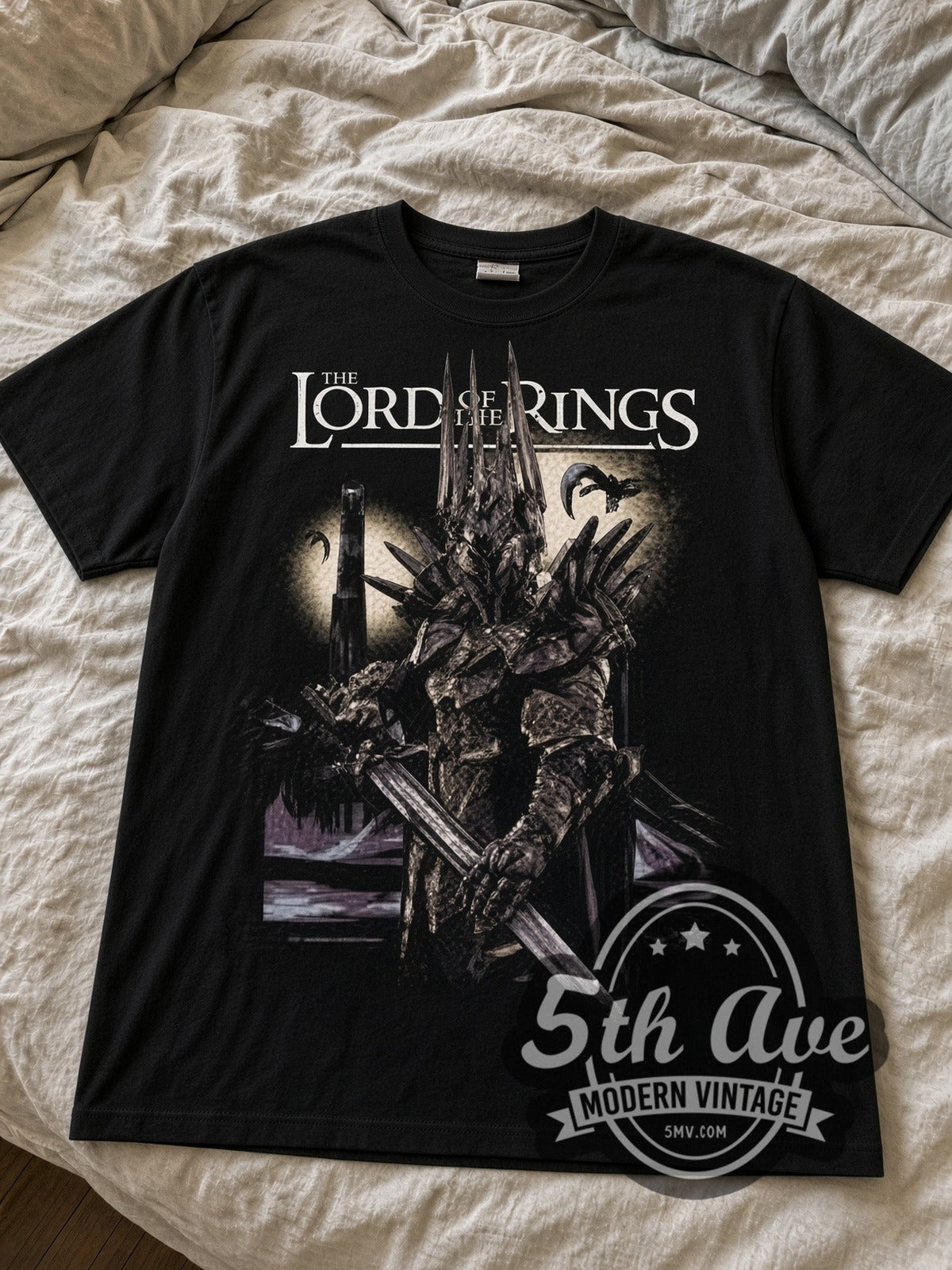 The Lord of the Rings Sauron black graphic tee laid flat on linen bed