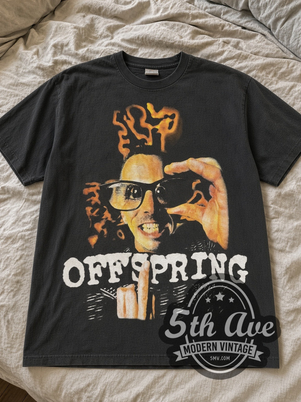 Black The Offspring band tee laid flat on linen bed