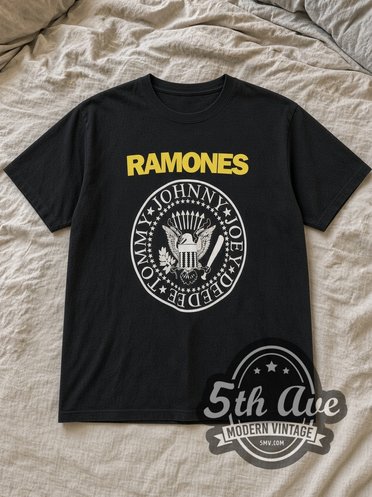 Black The Ramones Vintage Band T-Shirt laid flat on a linen bed