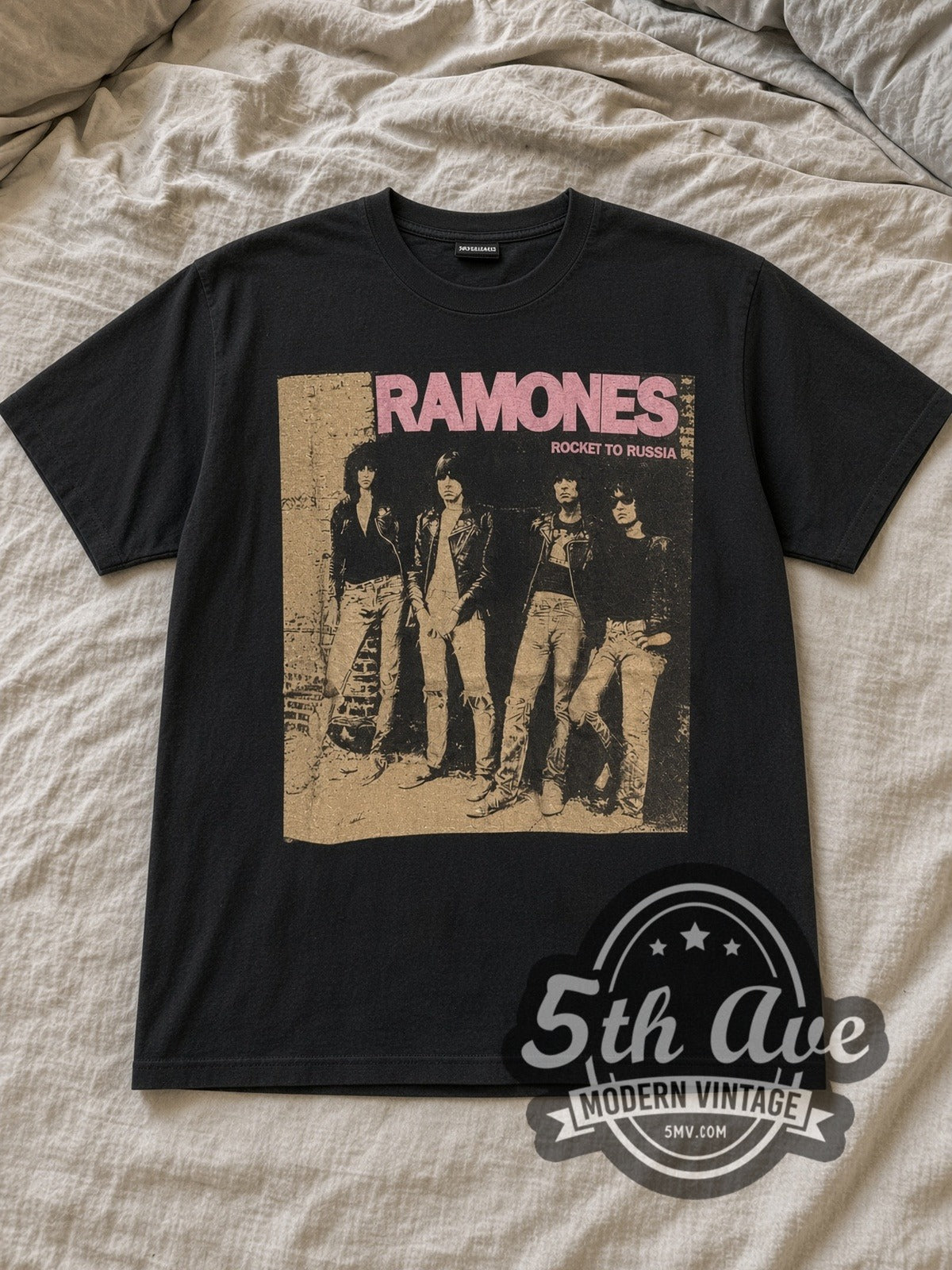 Black The Ramones Live at the CBGB's 1977 Vintage Band T-Shirt laid flat on a linen bed