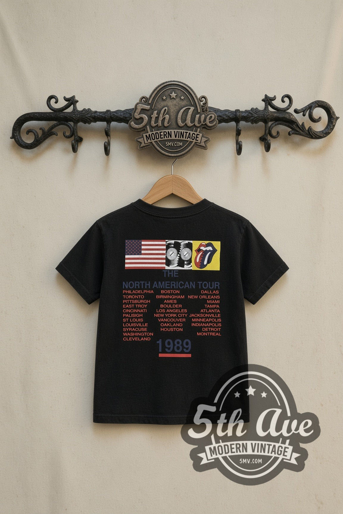 The Rolling Stones Classic Tongue kids band tee in black, back view on a display rack