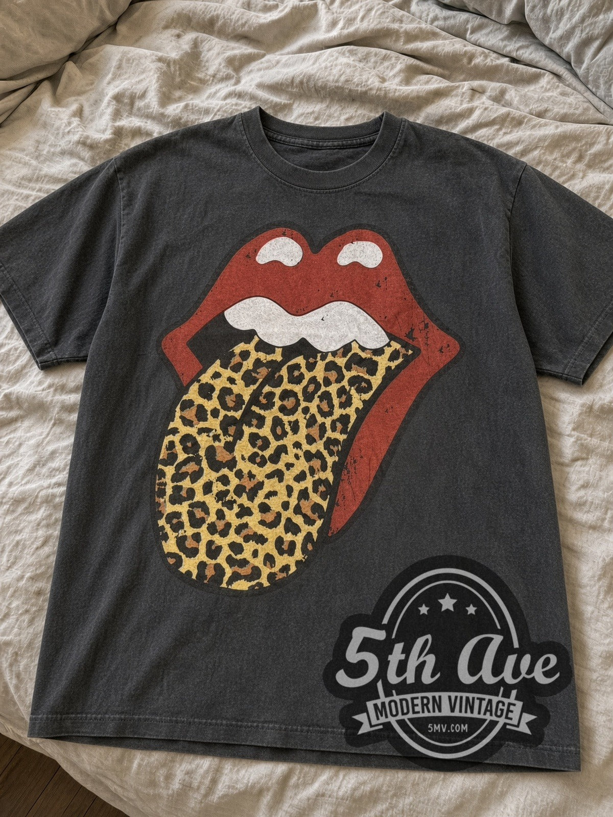 Faded Black The Rolling Stones Leopard Tongue North American Tour 1989 tee laid flat on linen bed