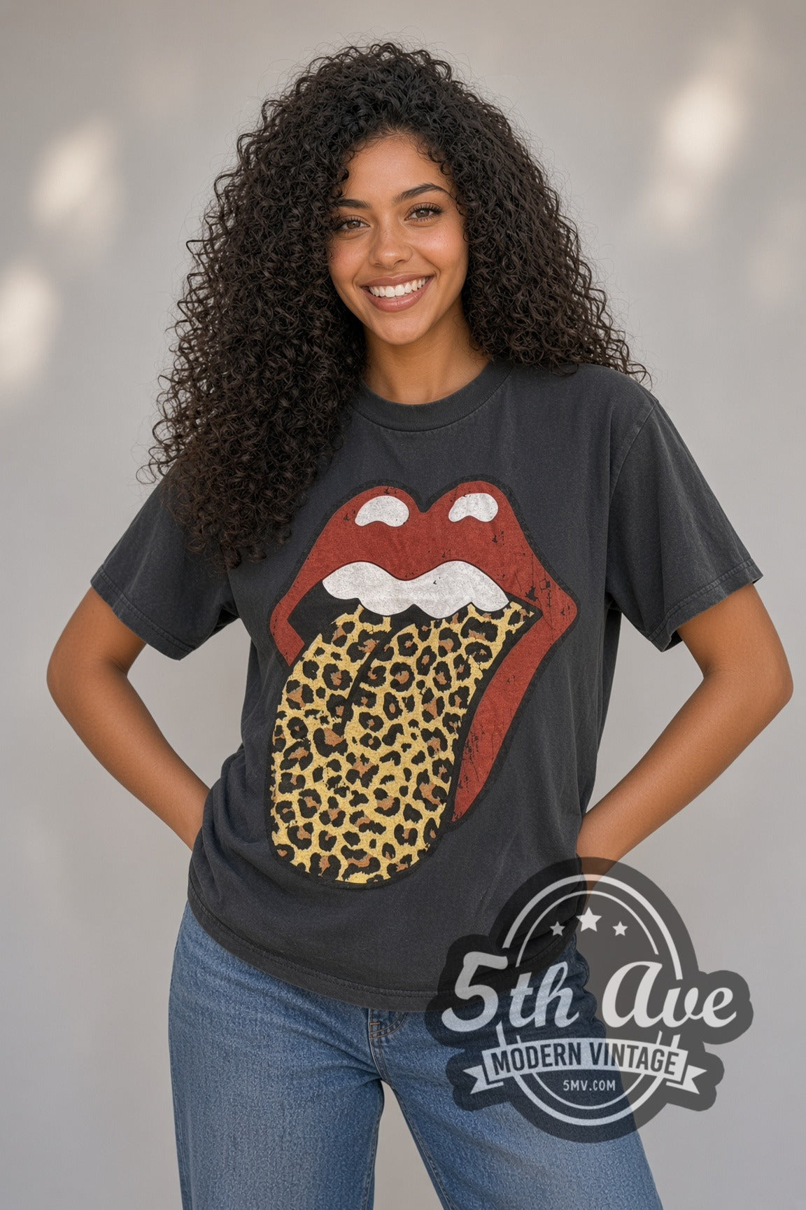 Woman wearing faded black The Rolling Stones Leopard Tongue North American Tour 1989 vintage band t-shirt