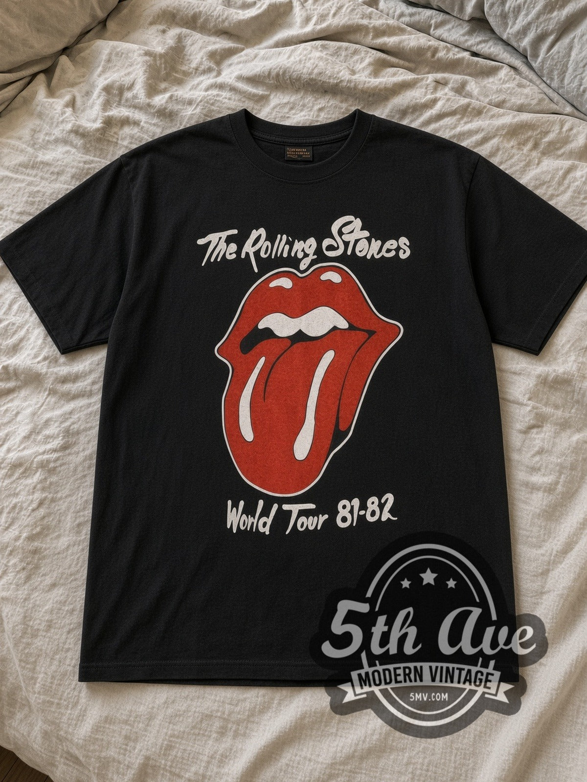 Black The Rolling Stones World Tour 1981 1982 Vintage Band T-Shirt laid flat on a linen bed