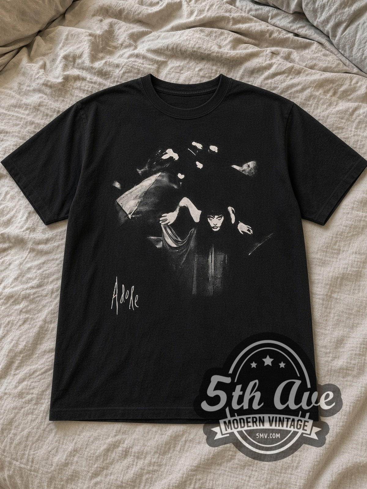 Black The Smashing Pumpkins Adore Vintage Band T-Shirt laid flat on a linen bed