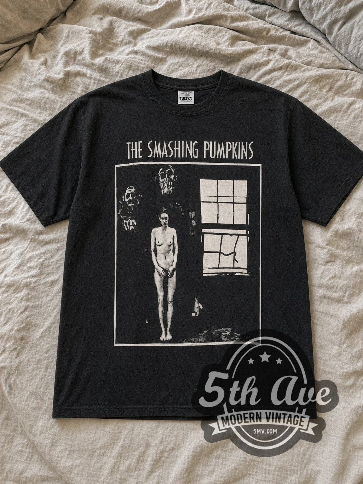 Black The Smashing Pumpkins Zero Figure Concentric Circle Back Vintage Band T-Shirt laid flat on a linen bed