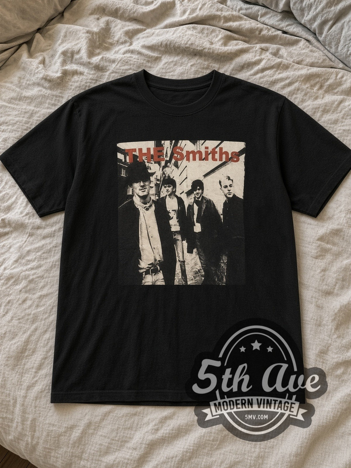 Black The Smiths Alleyway Band Photo Red Logo Vintage Band T-Shirt laid flat on a linen bed
