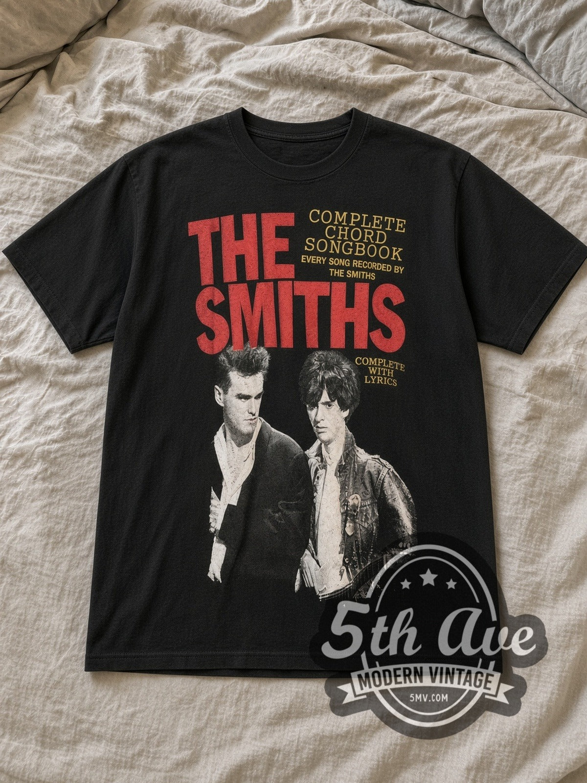 Black The Smiths Complete Chord Songbook Vintage Band T-Shirt laid flat on a linen bed
