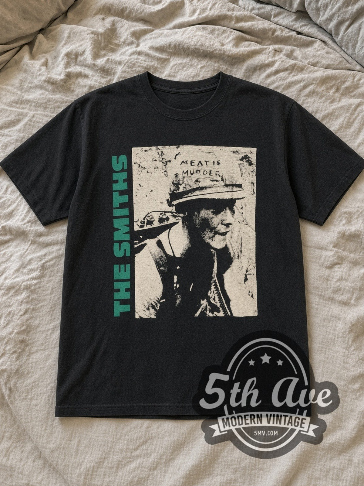 Black The Smiths Meat Is Murder Vintage Band T-Shirt laid flat on a linen bed