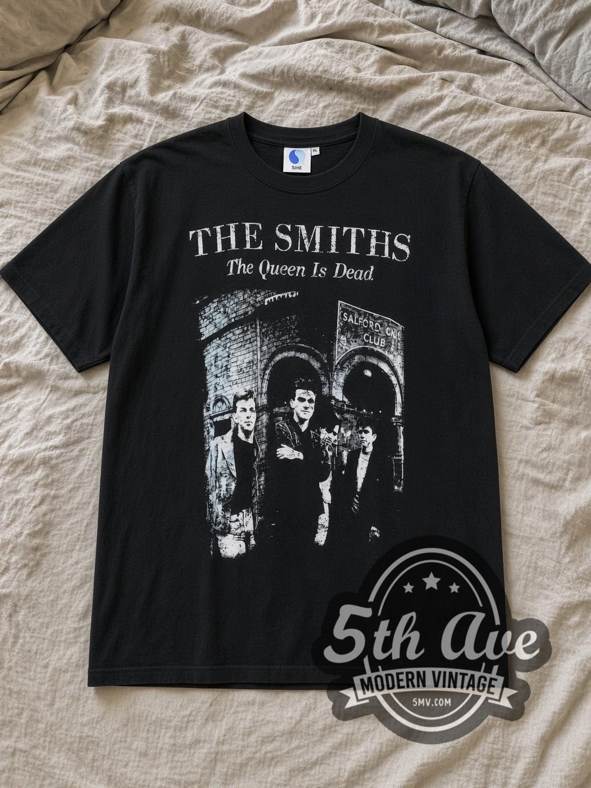 Black The Smiths The Queen Is Dead Vintage Band T-Shirt laid flat on a linen bed
