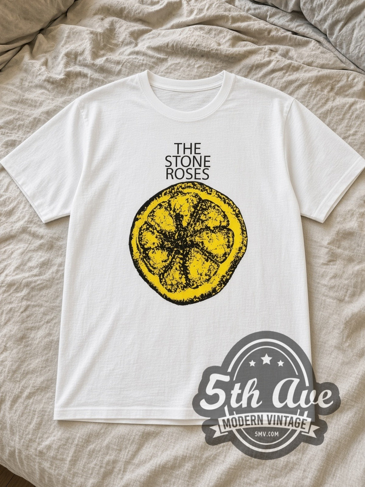 White The Stone Roses Vintage Band T-Shirt laid flat on a linen bed