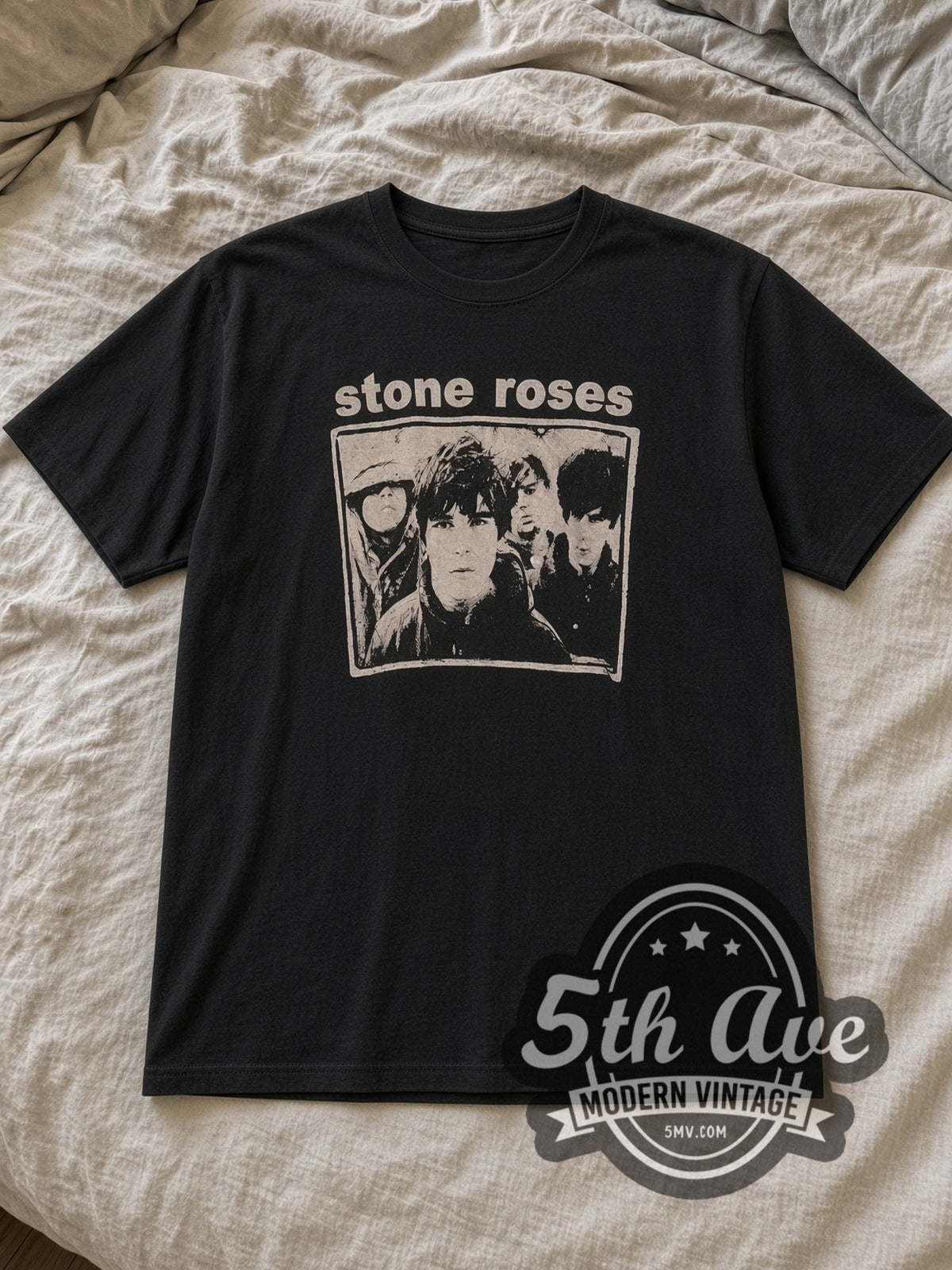 Black The Stone Roses Stone Roses Graphic Vintage Band T-Shirt laid flat on a linen bed