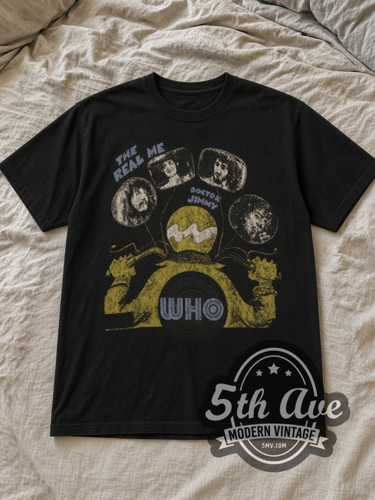 Black The Who Vintage Band T-Shirt laid flat on a linen bed