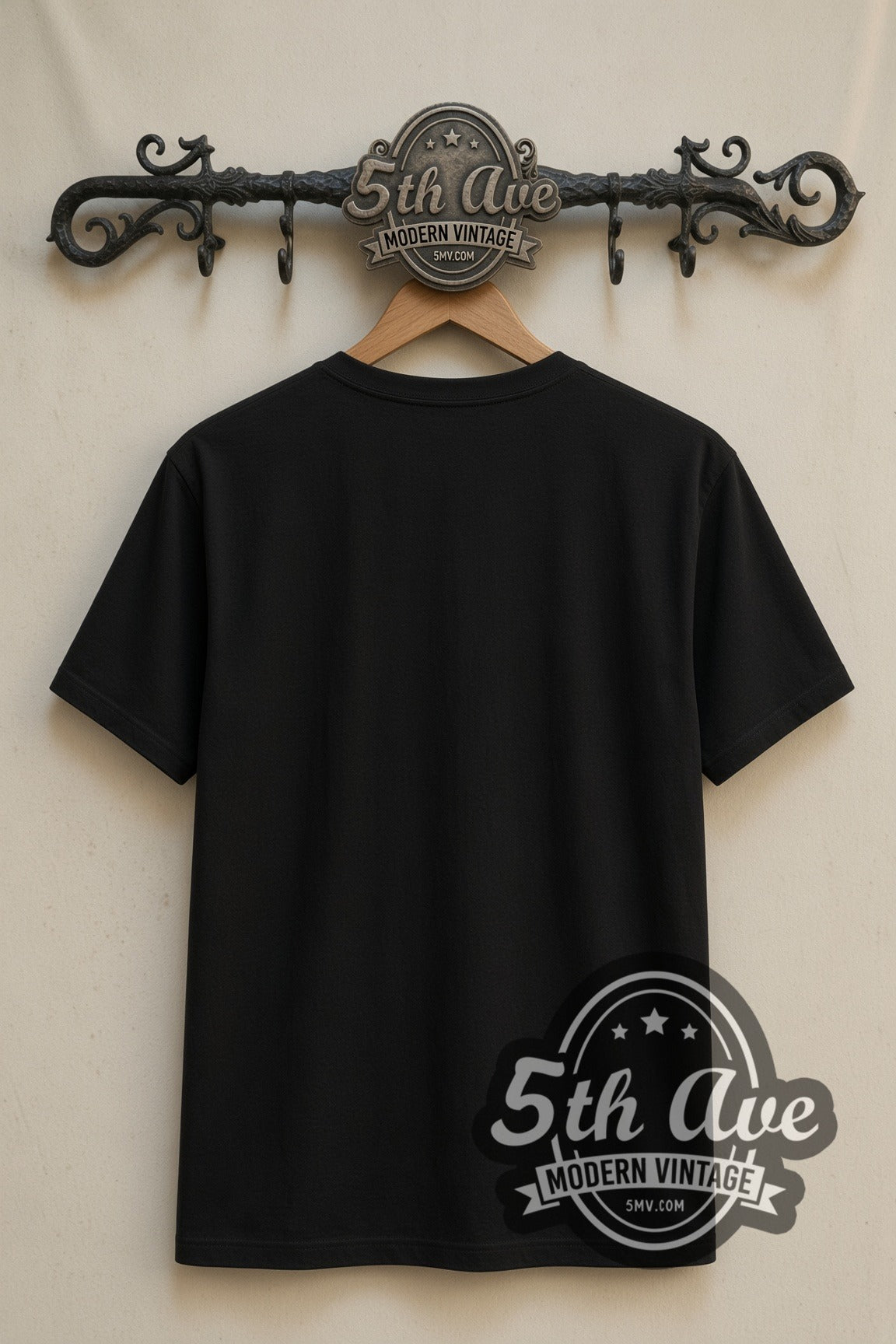 Plain black back of The Wild Robot Roz double stitched tee on rack