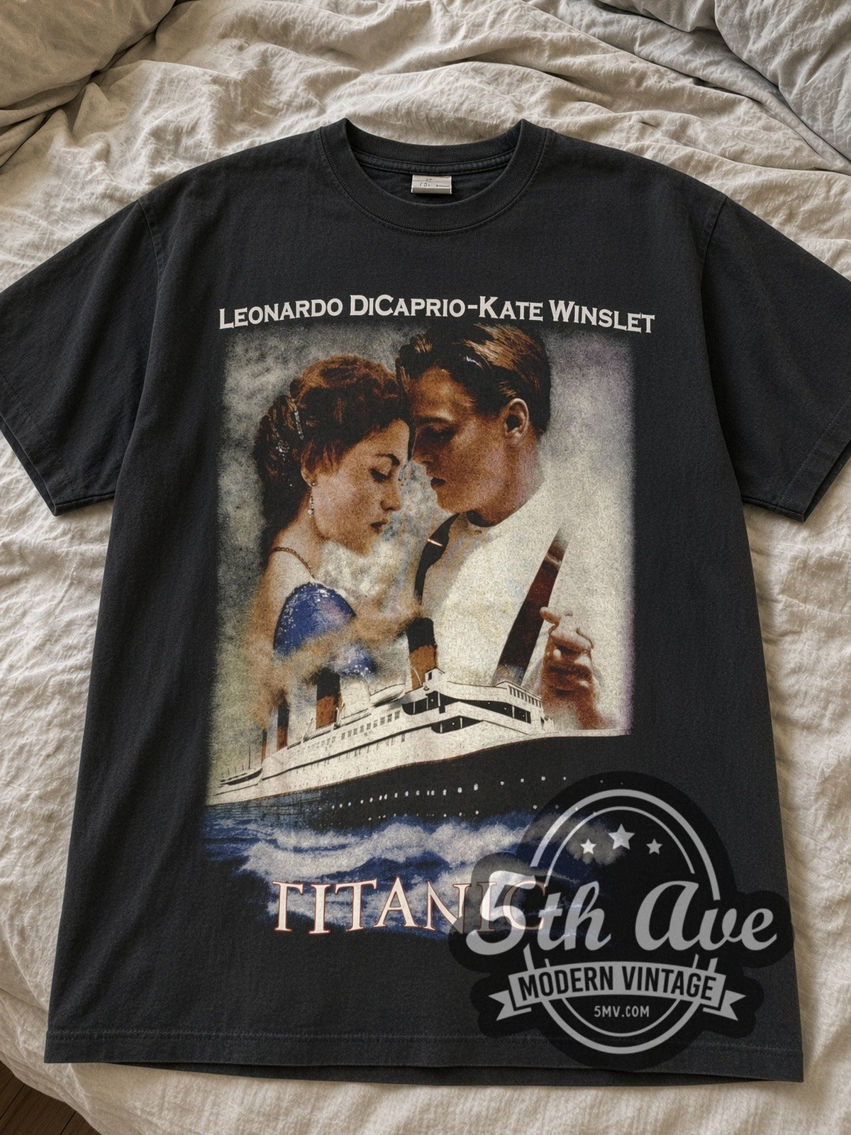 Black Titanic DiCaprio & Winslet Poster / Nothing on Earth tee laid flat on linen bed