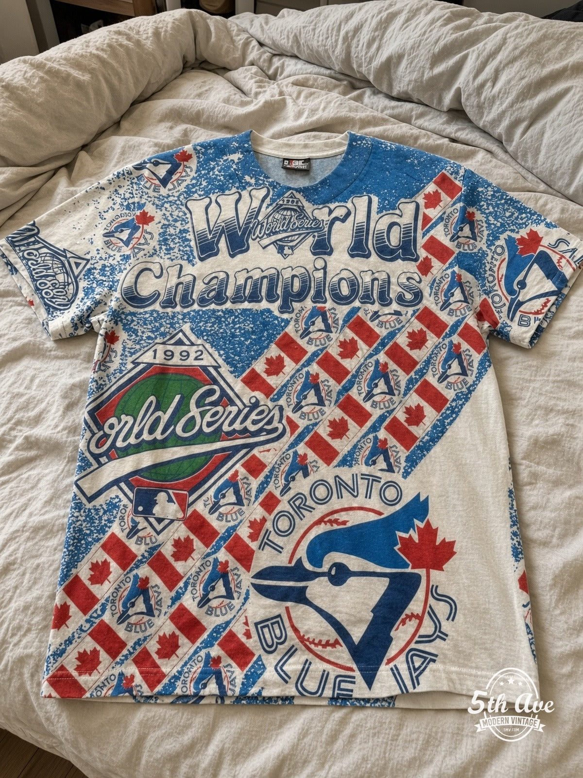 Toronto Blue Jays 1993 World Series Champions all over print vintage tee laid on bed
