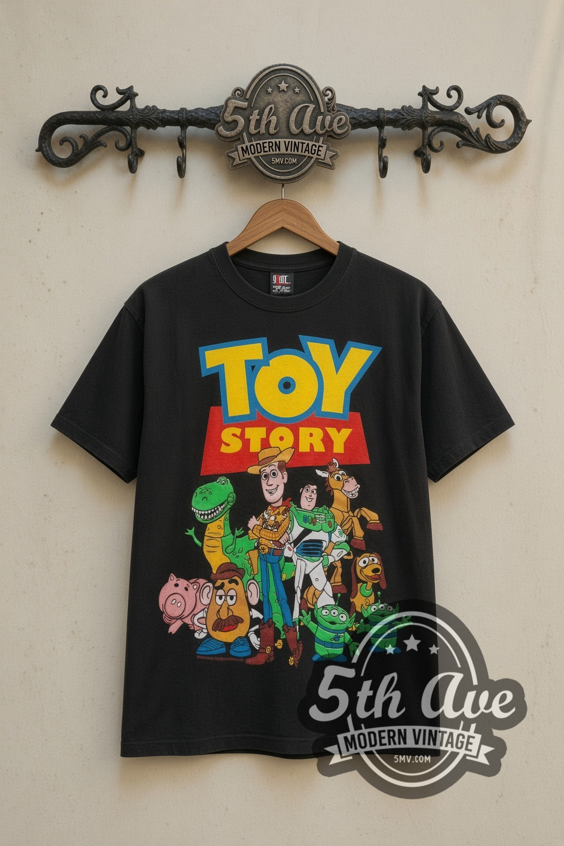 Toy Story Cast Group Logo movie tee in black, front view on a display rack