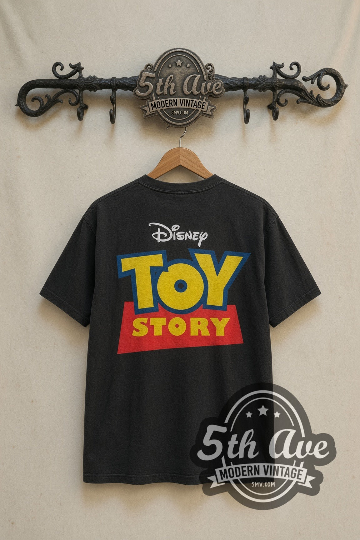 Toy Story Cast Group Logo movie tee in black, back view on a display rack