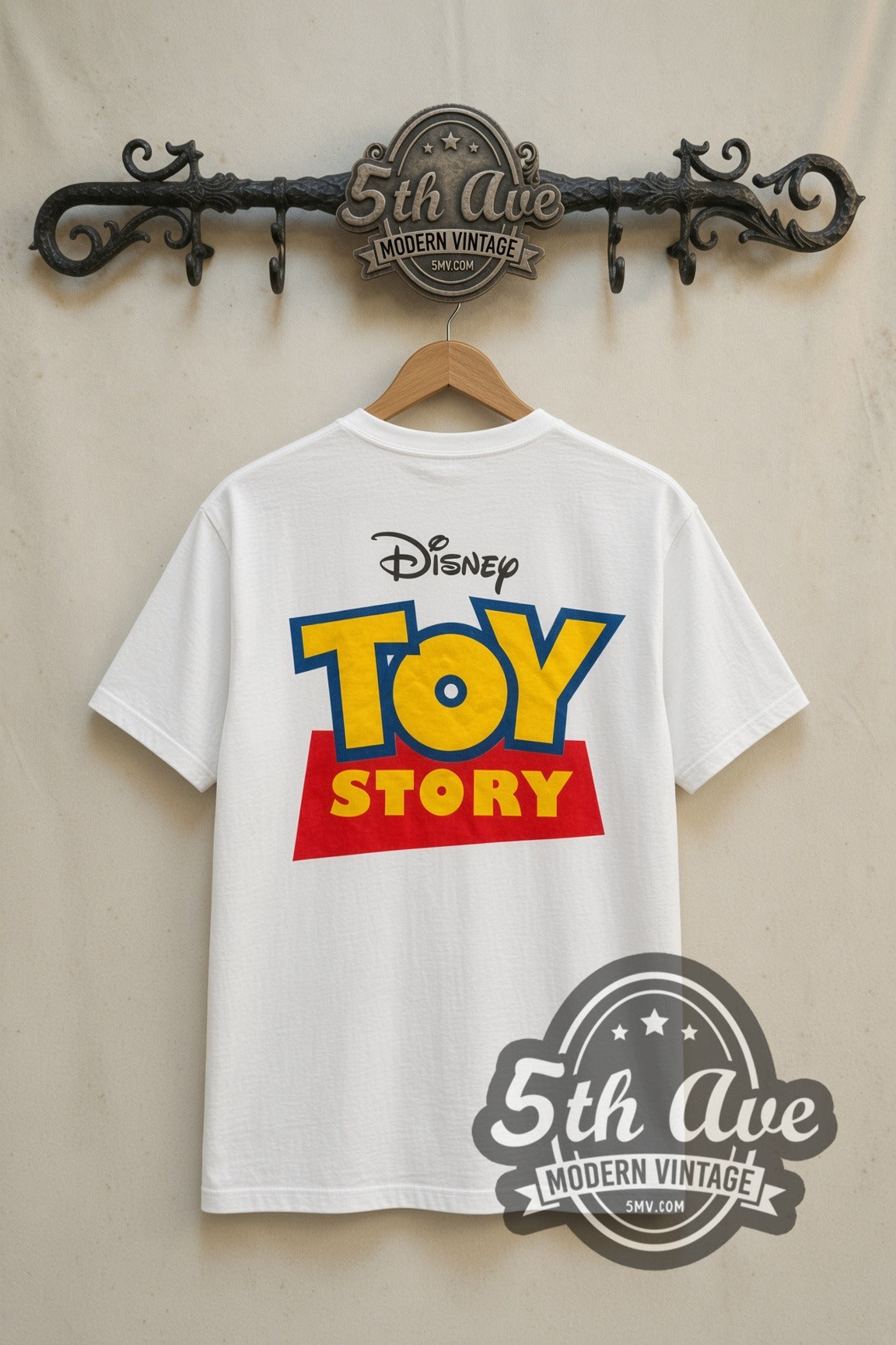 Toy Story Cast Group Logo movie tee in white, back view on a display rack