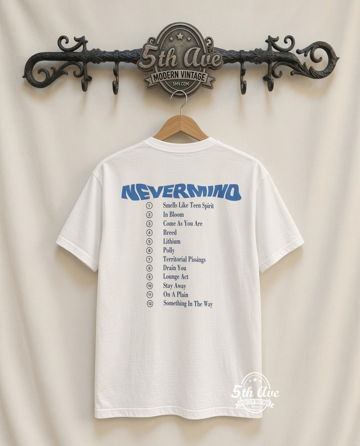Unveiling the Nirvana 'Nevermind' Album Tribute T-Shirt: A Timeless Homage to Musical Rebellion and Artistic Brilliance vintage tee on 5th Ave cream rack — back