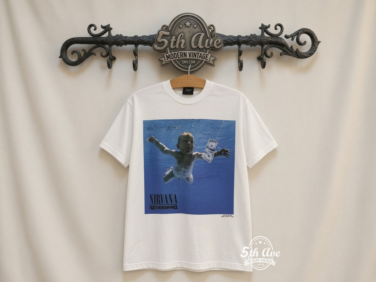 Unveiling the Nirvana 'Nevermind' Album Tribute T-Shirt: A Timeless Homage to Musical Rebellion and Artistic Brilliance vintage tee on 5th Ave cream rack — front